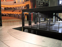 Revolving stage with integrated stage lift in a theatre